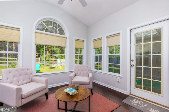 sunroom / solarium featuring lofted ceiling