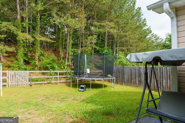 view of yard featuring a trampoline