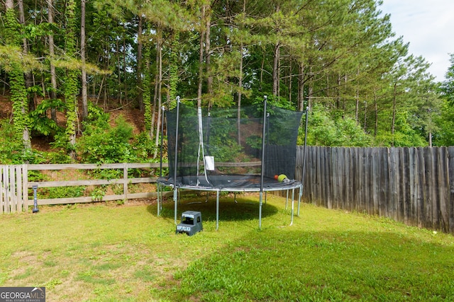 view of yard featuring a trampoline