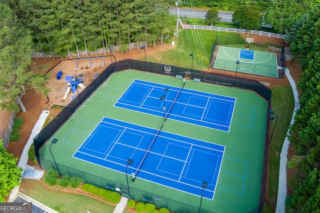 view of tennis court with fence