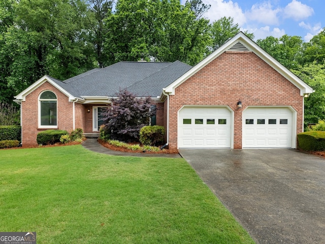 2910 Waverly Place Dr, Dacula, GA 30019 - view of front facade with asphalt driveway, brick siding, a garage, a front lawn, and a shingled roof