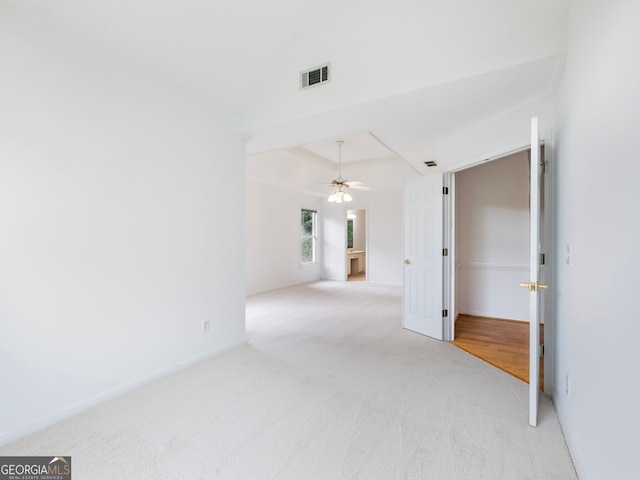 2910 Waverly Place Dr, Dacula, GA 30019 - carpeted empty room with a ceiling fan, a tray ceiling, crown molding, and baseboards