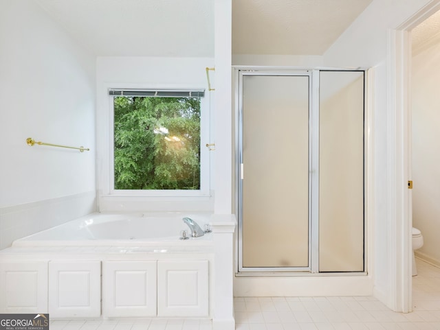 2910 Waverly Place Dr, Dacula, GA 30019 - full bathroom featuring a shower stall, toilet, a garden tub, and tile patterned flooring