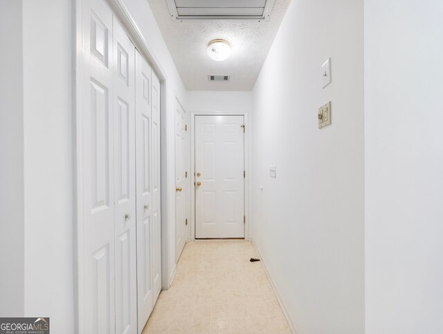 2910 Waverly Place Dr, Dacula, GA 30019 - corridor with baseboards and a textured ceiling
