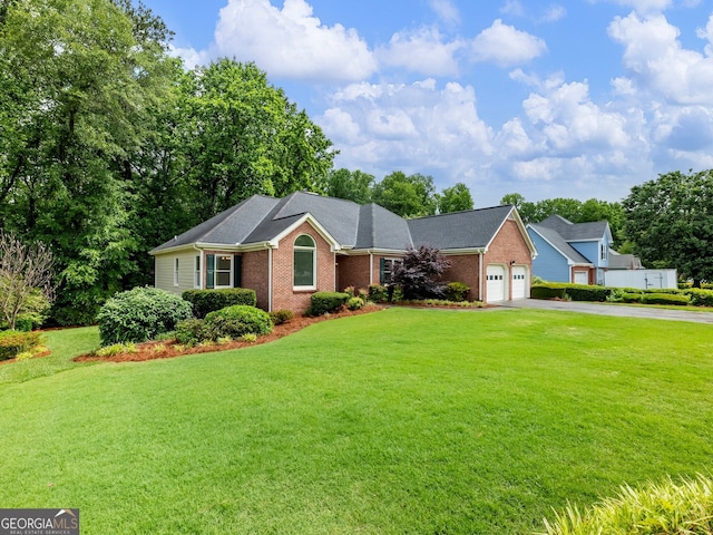 2910 Waverly Place Dr, Dacula, GA 30019 - ranch-style home featuring asphalt driveway, brick siding, a garage, and a front lawn