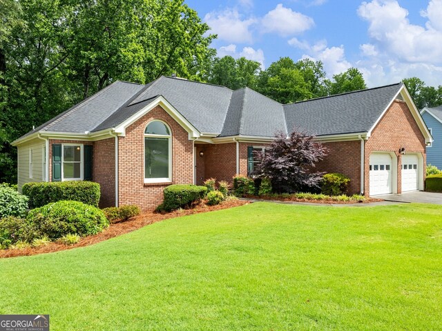 2910 Waverly Place Dr, Dacula, GA 30019 - single story home featuring an attached garage, a front yard, brick siding, and a shingled roof