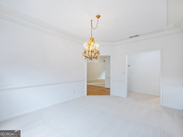 2910 Waverly Place Dr, Dacula, GA 30019 - spare room with a chandelier, carpet flooring, and crown molding
