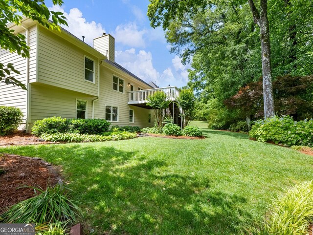2910 Waverly Place Dr, Dacula, GA 30019 - view of grassy yard with a wooden deck
