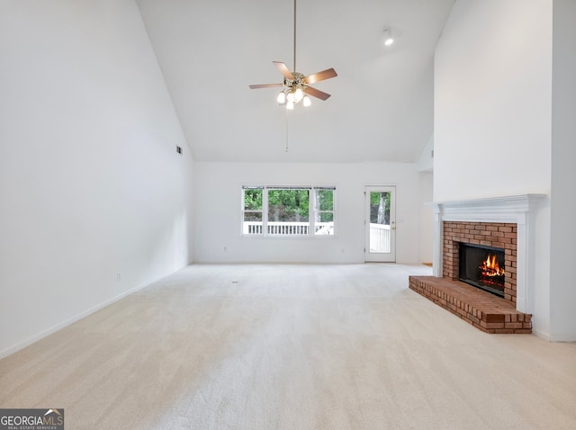 2910 Waverly Place Dr, Dacula, GA 30019 - unfurnished living room featuring high vaulted ceiling, carpet floors, ceiling fan, a fireplace, and baseboards