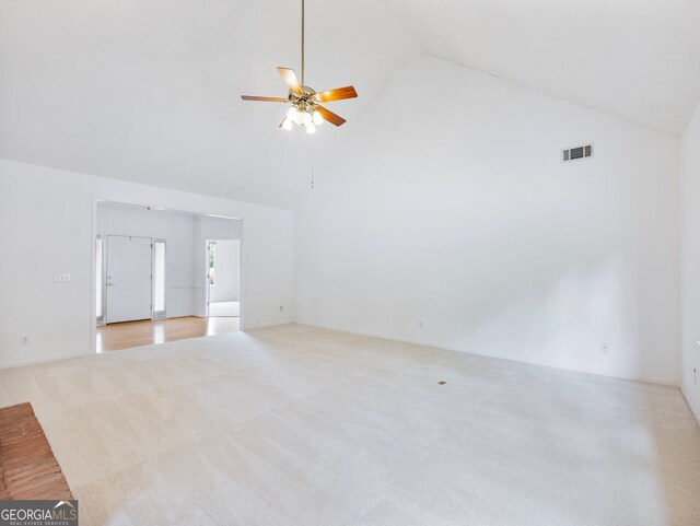2910 Waverly Place Dr, Dacula, GA 30019 - unfurnished living room featuring carpet flooring, high vaulted ceiling, and ceiling fan