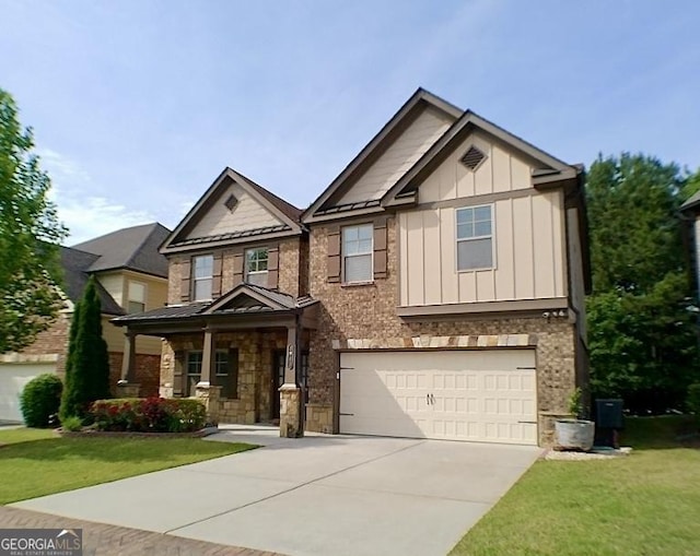 3943 Ridge Grove Way, Suwanee, GA 30024 - view of front facade featuring board and batten siding, covered porch, stone siding, driveway, and a front lawn