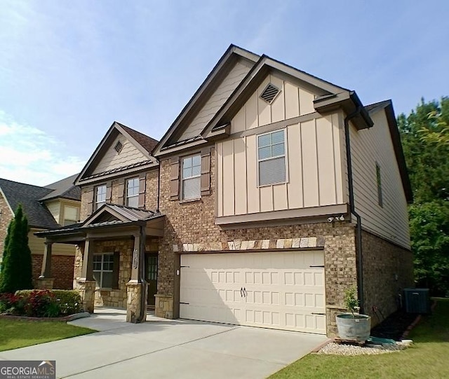 3943 Ridge Grove Way, Suwanee, GA 30024 - view of front of home with driveway, an attached garage, brick siding, stone siding, and board and batten siding