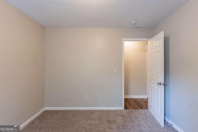 6015 Sumit Ct NW, Kennesaw, GA 30152 - carpeted empty room featuring a textured ceiling and baseboards