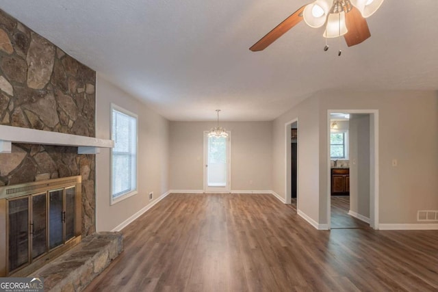 6015 Sumit Ct NW, Kennesaw, GA 30152 - unfurnished living room with wood finished floors, healthy amount of natural light, baseboards, and a fireplace