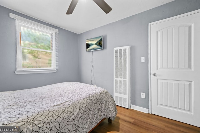 210 Estoria St SE, Atlanta, GA 30316 - bedroom with a heating unit, wood finished floors, and ceiling fan