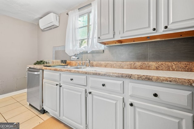 210 Estoria St SE, Atlanta, GA 30316 - kitchen featuring a wall mounted AC, dishwasher, white cabinets, light countertops, and light tile patterned floors