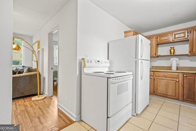 210 Estoria St SE, Atlanta, GA 30316 - kitchen with white appliances, open shelves, light countertops, brown cabinetry, and light tile patterned floors