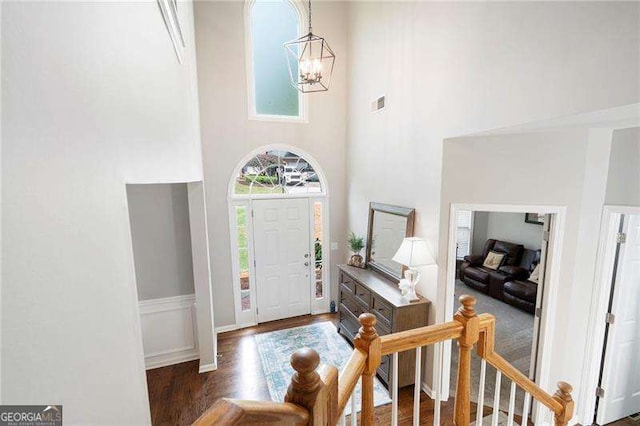 101 Misty Valley Dr, Canton, GA 30114 - entrance foyer with a chandelier, wood finished floors, and a towering ceiling