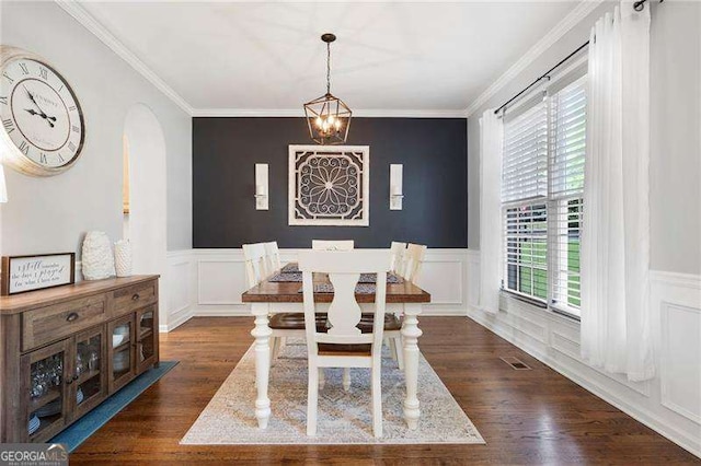 101 Misty Valley Dr, Canton, GA 30114 - dining room with dark wood-style floors, arched walkways, a wainscoted wall, ornamental molding, and a decorative wall