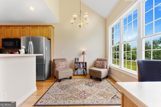 85 Majestic Shores Trl, Hartwell, GA 30643 - sitting room with lofted ceiling, a chandelier, light wood-type flooring, baseboards, and recessed lighting