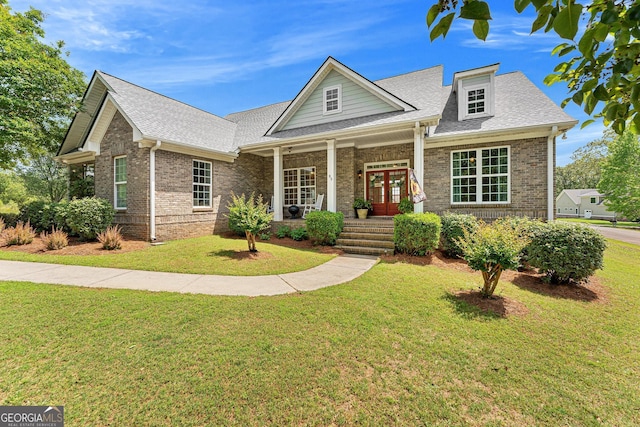 85 Majestic Shores Trl, Hartwell, GA 30643 - view of front of property featuring covered porch, brick siding, roof with shingles, and a front yard