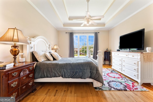 85 Majestic Shores Trl, Hartwell, GA 30643 - bedroom with a raised ceiling, crown molding, wood finished floors, and a ceiling fan