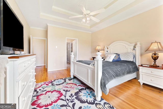 85 Majestic Shores Trl, Hartwell, GA 30643 - bedroom with a raised ceiling, light wood finished floors, ornamental molding, and ceiling fan