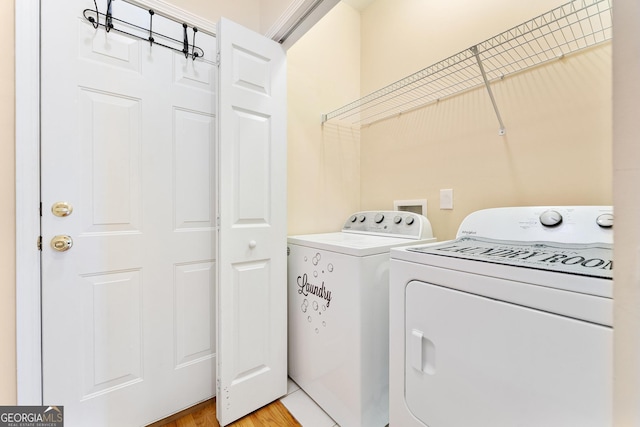 85 Majestic Shores Trl, Hartwell, GA 30643 - clothes washing area with washer and clothes dryer and light wood-type flooring
