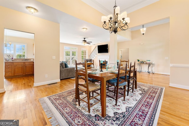 85 Majestic Shores Trl, Hartwell, GA 30643 - dining area with healthy amount of natural light, light wood-style floors, ceiling fan, and crown molding