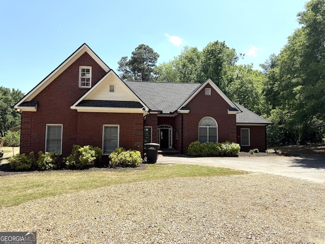 34 Pine Grove Rd, Cartersville, GA 30120 - traditional home with brick siding, roof with shingles, concrete driveway, and a front yard