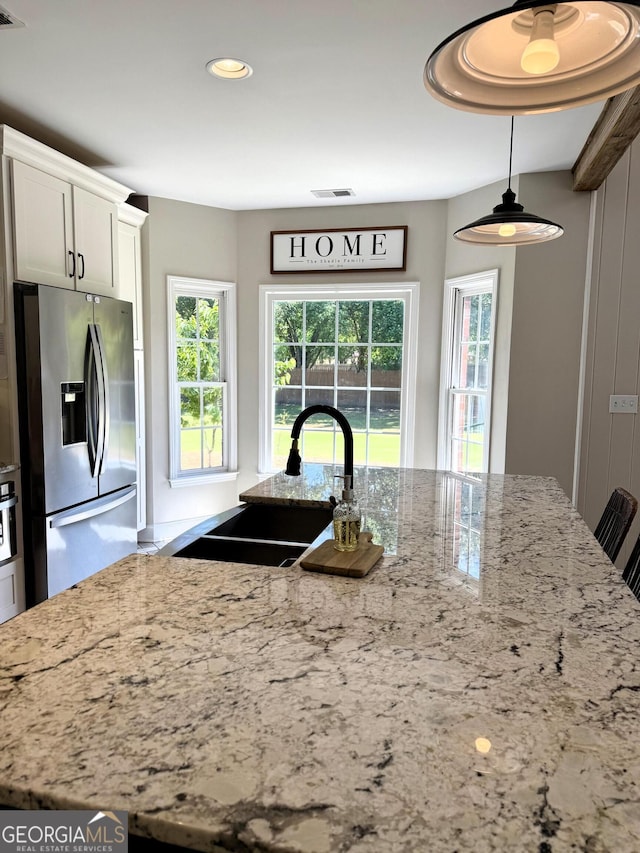 34 Pine Grove Rd, Cartersville, GA 30120 - kitchen featuring stainless steel fridge, a sink, light stone countertops, plenty of natural light, and recessed lighting
