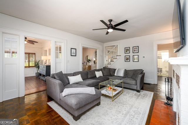 1448 N Highland Ave NE, Atlanta, GA 30306 - living room featuring a ceiling fan, a fireplace, and stairs