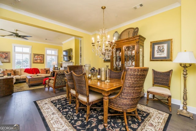 963 S On Main Dr, Woodstock, GA 30188 - dining area with a chandelier, dark wood finished floors, crown molding, and a ceiling fan