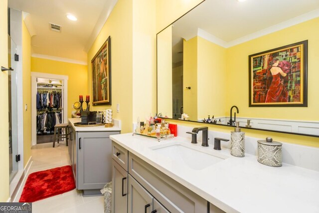 963 S On Main Dr, Woodstock, GA 30188 - bathroom with ornamental molding, vanity, tile patterned flooring, recessed lighting, and a walk in closet