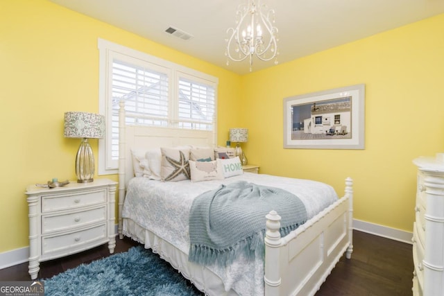 963 S On Main Dr, Woodstock, GA 30188 - bedroom with a chandelier, baseboards, and dark wood-type flooring