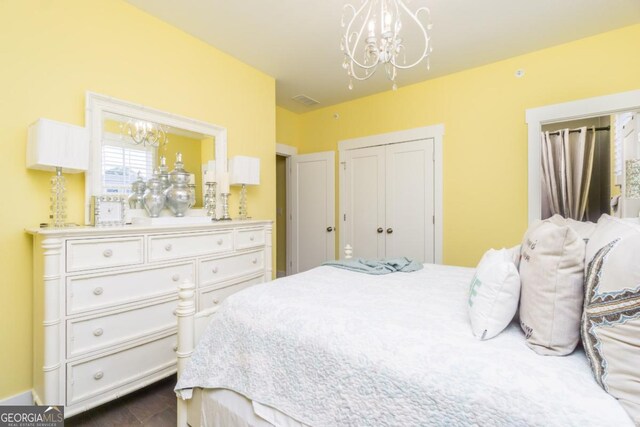 963 S On Main Dr, Woodstock, GA 30188 - bedroom featuring a chandelier and a closet