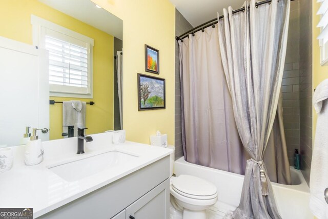 963 S On Main Dr, Woodstock, GA 30188 - bathroom with vanity, shower / tub combo, and toilet