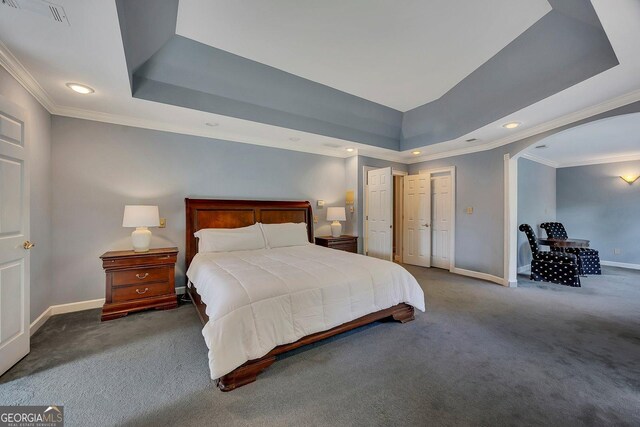 181 Sentinel Pl NE, Marietta, GA 30067 - carpeted bedroom with baseboards, a tray ceiling, arched walkways, recessed lighting, and ornamental molding