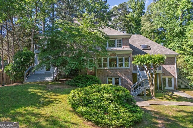 181 Sentinel Pl NE, Marietta, GA 30067 - view of front of property featuring stairway, french doors, a front yard, and brick siding