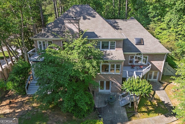 view from above of property with a forest