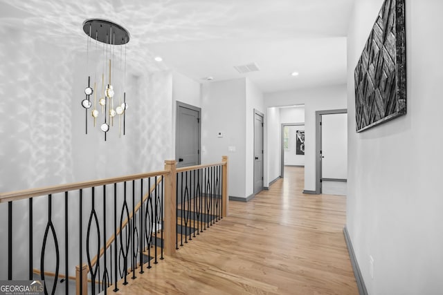 3378 Bachelor St, Atlanta, GA 30344 - hall featuring an upstairs landing, light wood finished floors, baseboards, recessed lighting, and a chandelier