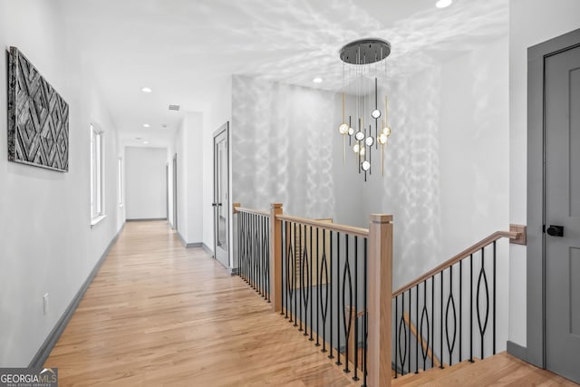 3378 Bachelor St, Atlanta, GA 30344 - hallway featuring an upstairs landing, wood finished floors, recessed lighting, and a chandelier
