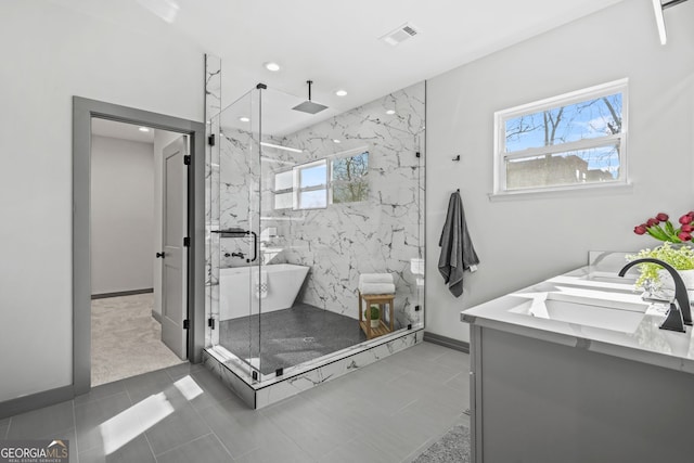 3378 Bachelor St, Atlanta, GA 30344 - bathroom featuring a marble finish shower, a freestanding tub, double vanity, recessed lighting, and baseboards
