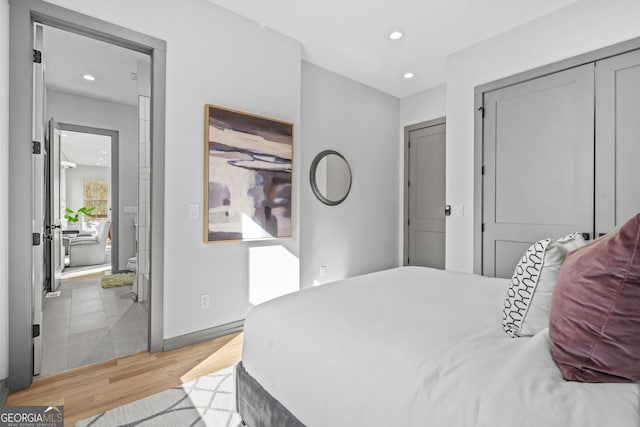 3378 Bachelor St, Atlanta, GA 30344 - bedroom featuring light wood-type flooring, recessed lighting, baseboards, and a closet