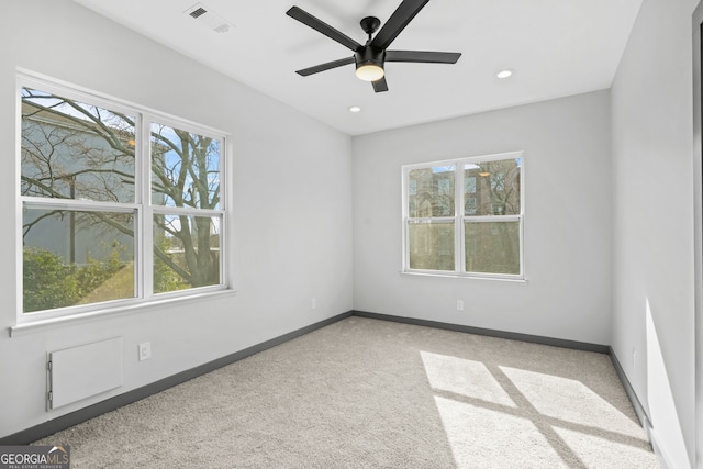 3378 Bachelor St, Atlanta, GA 30344 - empty room featuring plenty of natural light, light colored carpet, baseboards, a ceiling fan, and recessed lighting