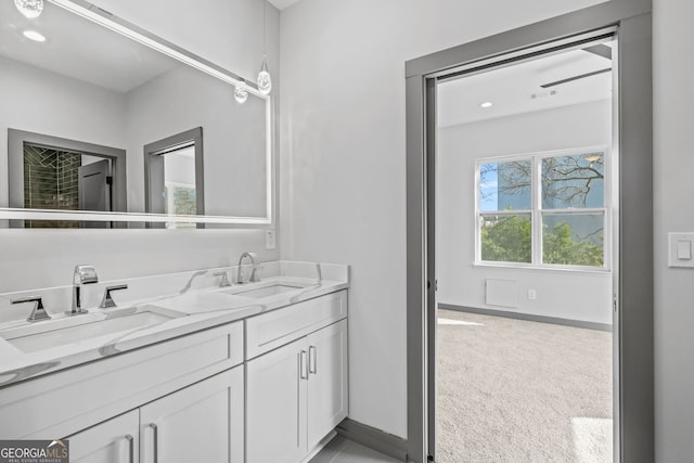 3378 Bachelor St, Atlanta, GA 30344 - full bath with double vanity, baseboards, and recessed lighting