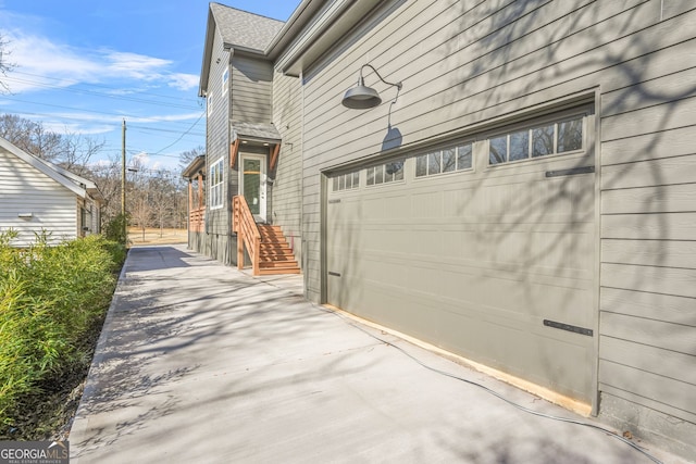 3378 Bachelor St, Atlanta, GA 30344 - view of side of property featuring driveway and an attached garage