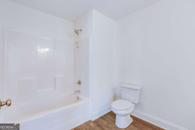 541 Day Star Ln, Mount Airy, GA 30563 - bathroom featuring toilet, baseboards, wood finished floors, and tub / shower combination