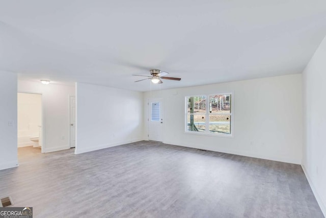 541 Day Star Ln, Mount Airy, GA 30563 - unfurnished room with wood finished floors, a ceiling fan, and baseboards