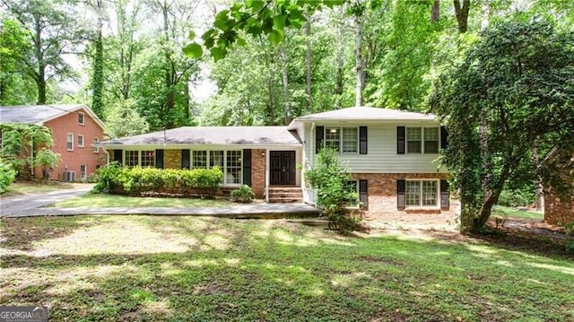 2620 Clairmont Rd, Atlanta, GA 30329 - split level home with a front lawn and brick siding